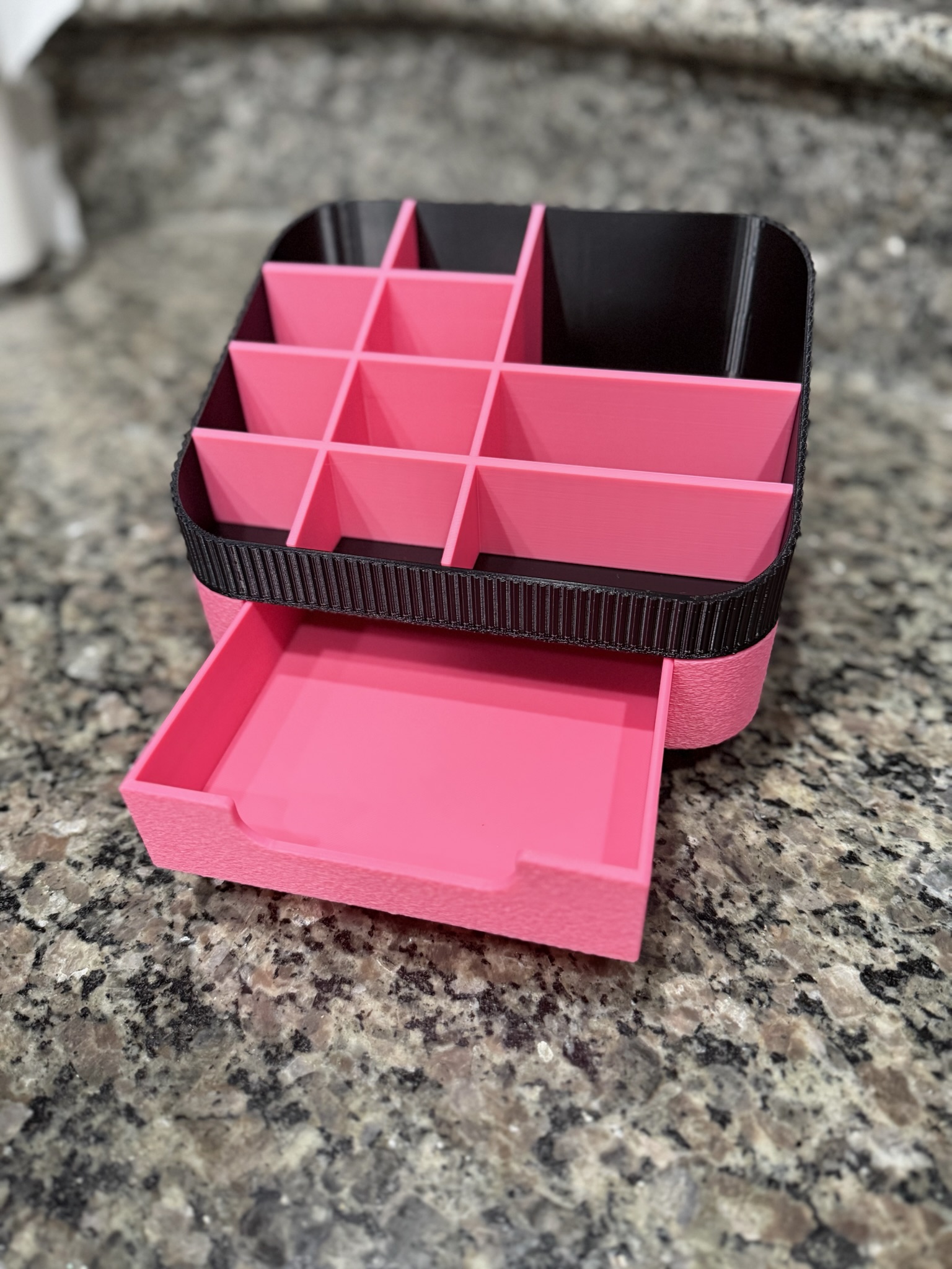 Pink and black 3D-printed makeup display case