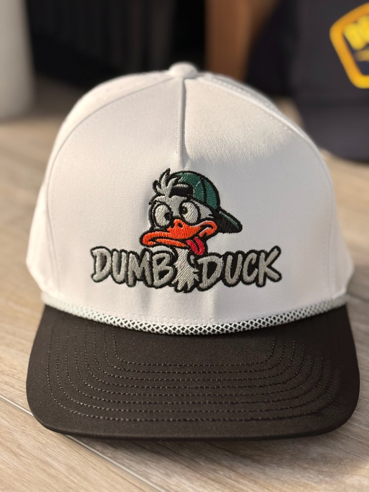 White rope hat with Dumb Duck embroidery
